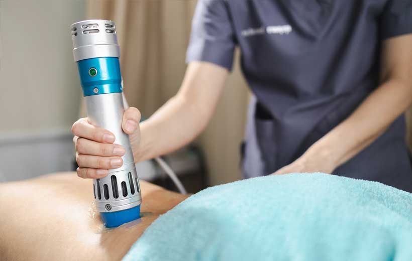 patient receiving shockwave therapy in San Diego for pain relief